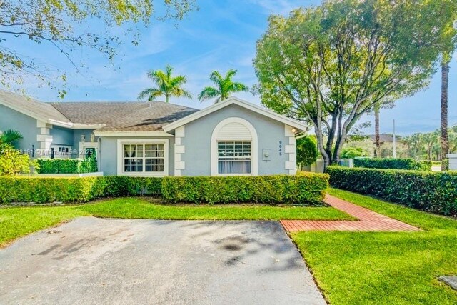 9645 SW 142nd Ct, Miami, FL 33186 - view of front facade featuring a front yard