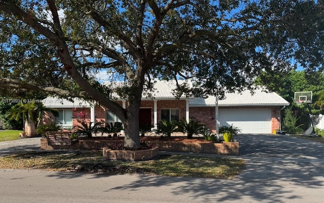 ranch-style house featuring a garage