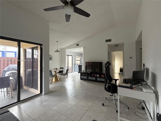 home office with light tile patterned floors and high vaulted ceiling