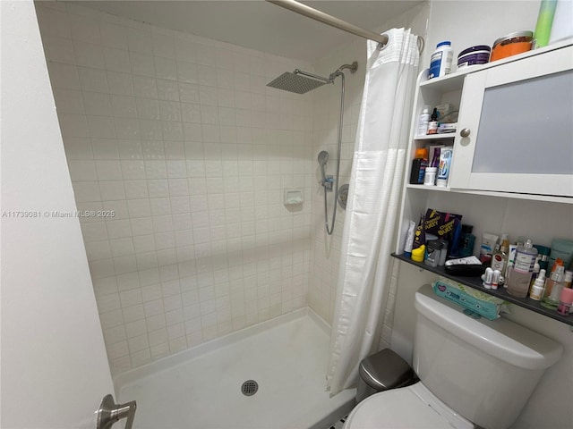 bathroom with walk in shower and toilet