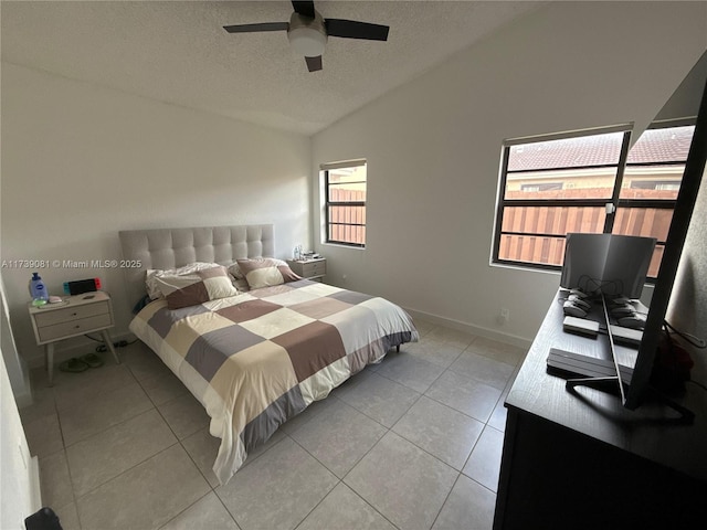 bedroom featuring lofted ceiling, ceiling fan, a textured ceiling, and light tile patterned flooring