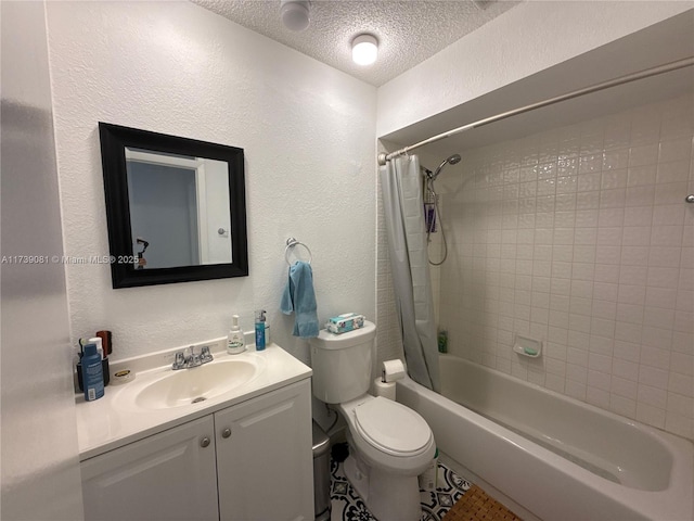 full bathroom with shower / tub combo with curtain, vanity, toilet, and a textured ceiling