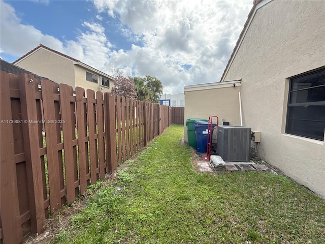 view of yard with central AC unit