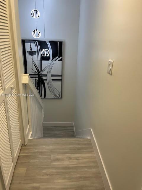 stairway featuring hardwood / wood-style floors