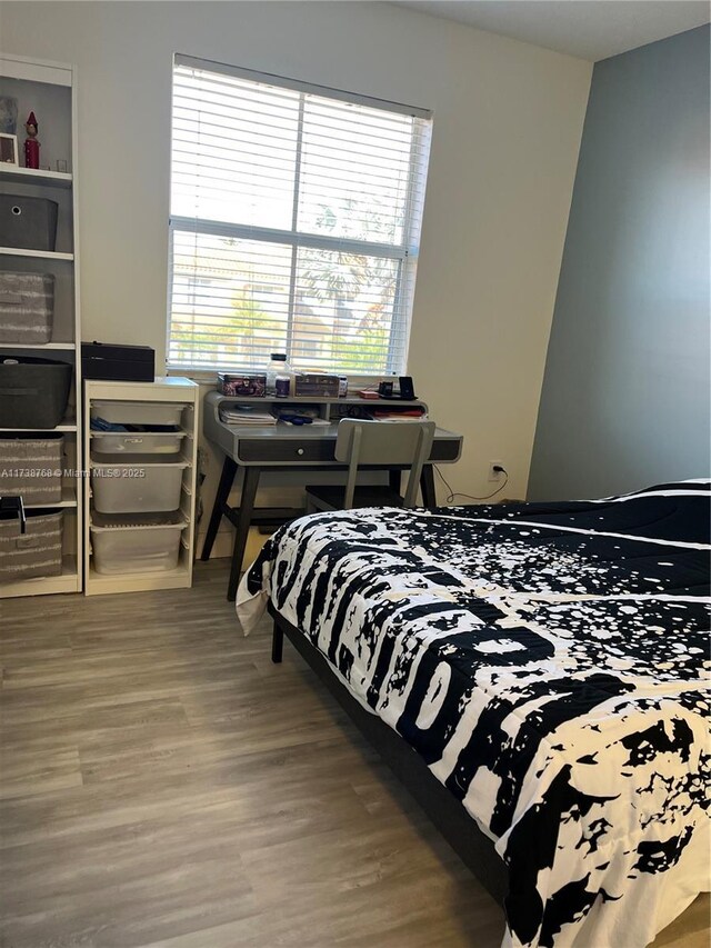 bedroom featuring dark hardwood / wood-style floors