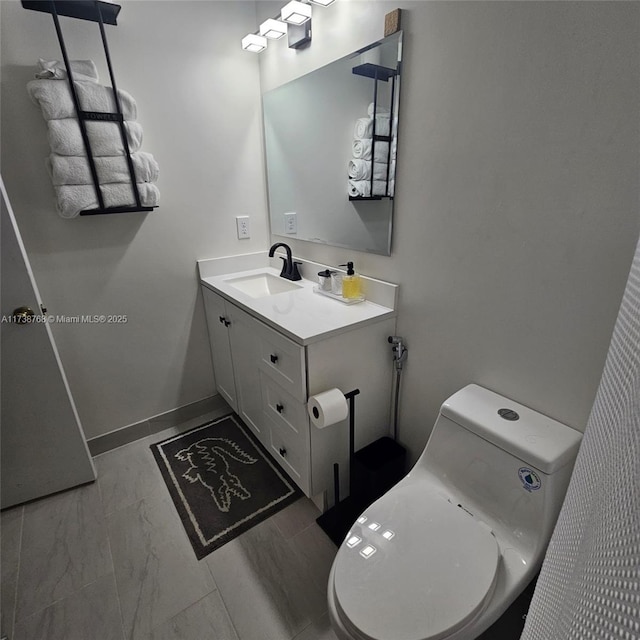 bathroom with vanity and toilet