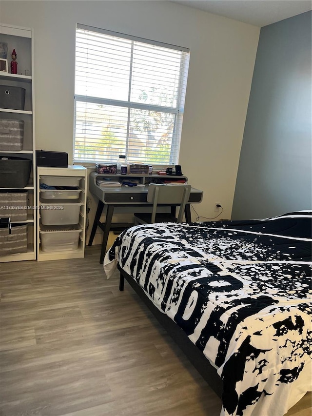 bedroom featuring wood-type flooring