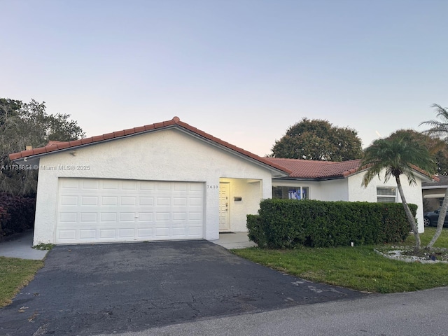 single story home featuring a garage