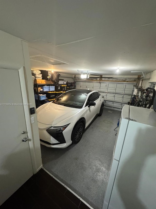 garage with white refrigerator