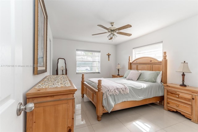 bedroom with light tile patterned floors and ceiling fan