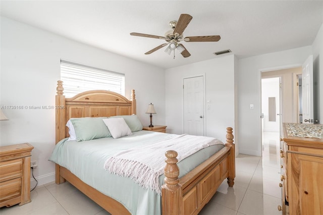 bedroom featuring light tile patterned flooring and ceiling fan