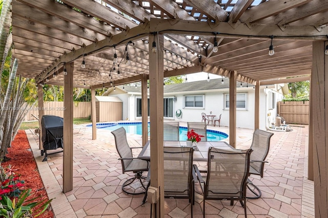 view of patio with a fenced in pool, a pergola, and a shed