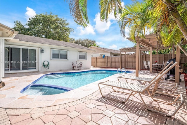 view of swimming pool featuring an in ground hot tub, a pergola, and a patio area