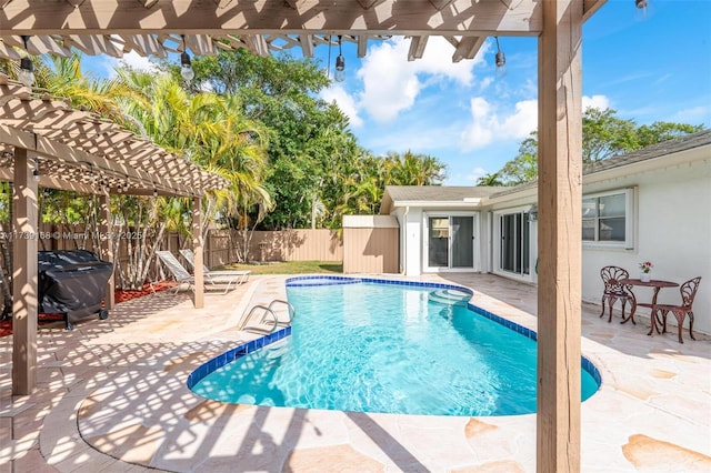 view of pool with a pergola, a patio, and ceiling fan