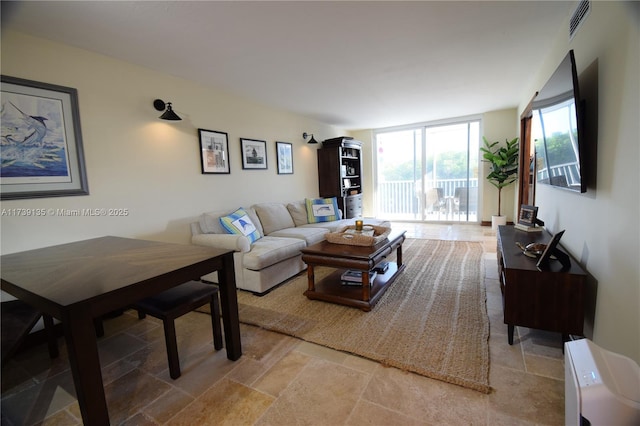 living room with floor to ceiling windows