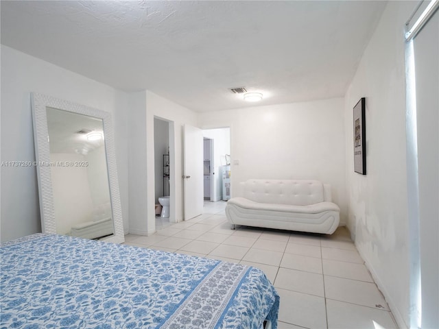 bedroom featuring light tile patterned flooring