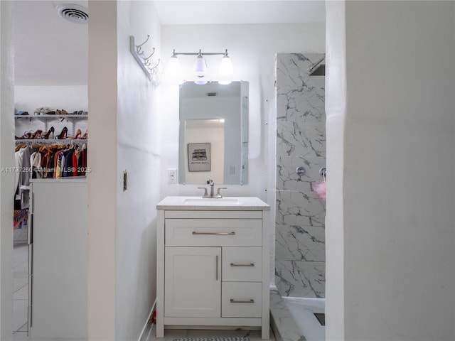 bathroom featuring vanity and walk in shower