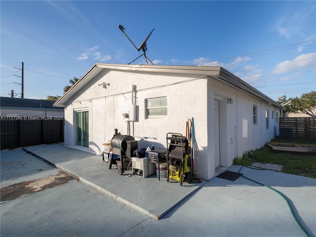 rear view of property featuring a patio area