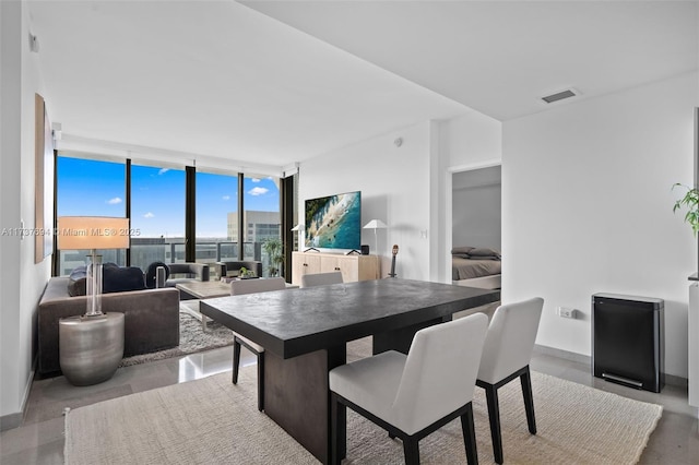 dining area with floor to ceiling windows