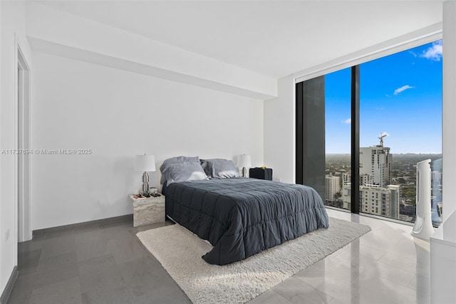 bedroom featuring floor to ceiling windows