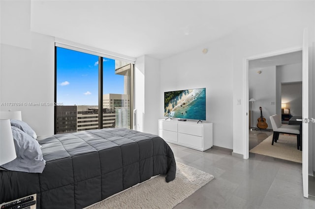 bedroom featuring a wall of windows