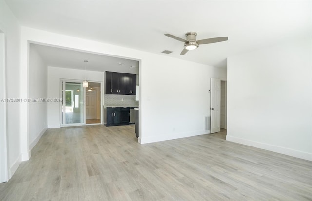 empty room featuring light hardwood / wood-style flooring and ceiling fan