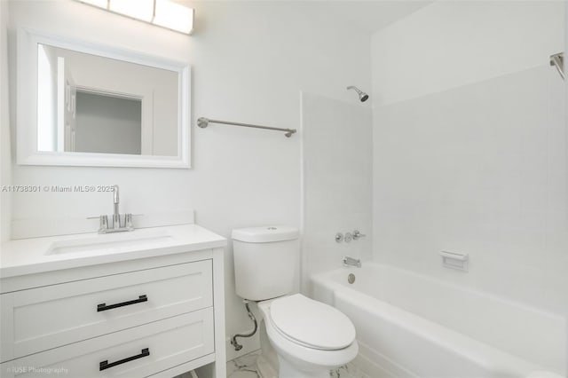 bathroom featuring shower / bathing tub combination, toilet, marble finish floor, and vanity