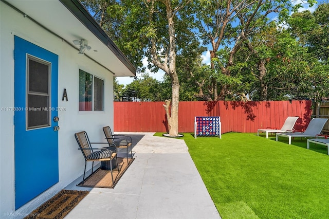 view of yard featuring a patio area and fence