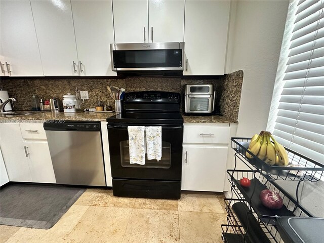 bathroom with vanity, toilet, tile patterned floors, and walk in shower