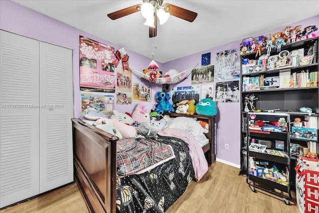 bedroom featuring ceiling fan and light hardwood / wood-style floors