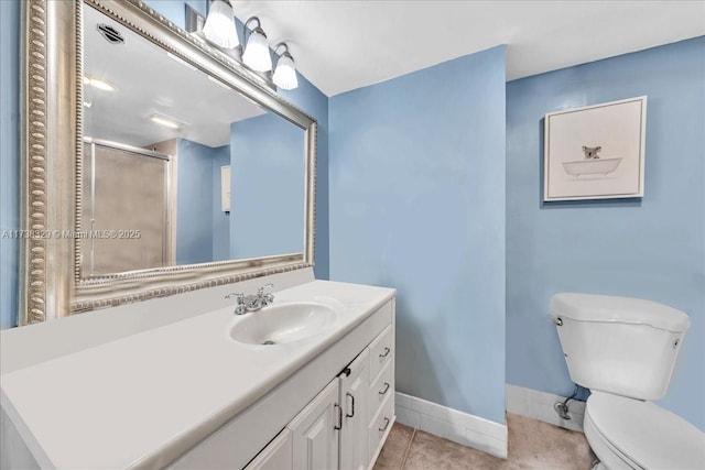 bathroom featuring walk in shower, vanity, toilet, and tile patterned flooring