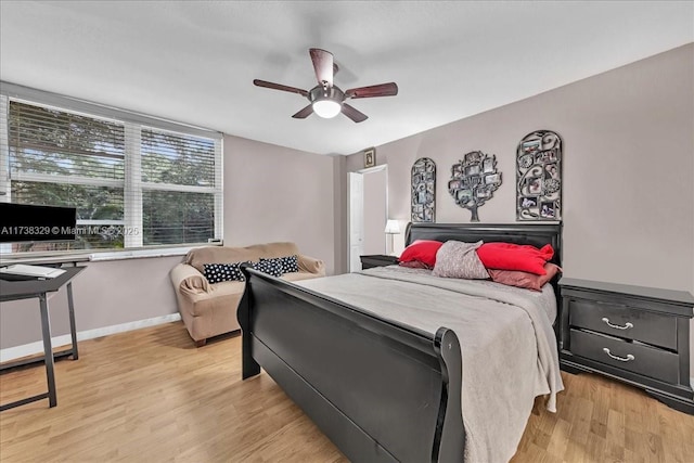 bedroom with ceiling fan and light hardwood / wood-style flooring