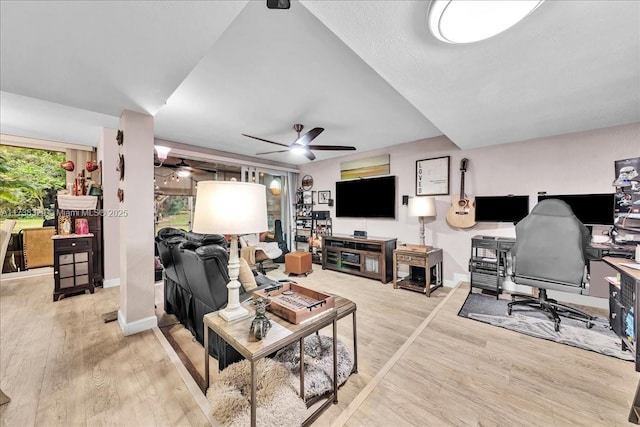 living room with ceiling fan and light hardwood / wood-style floors