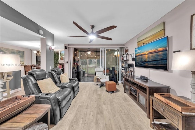 living room featuring light hardwood / wood-style flooring and ceiling fan