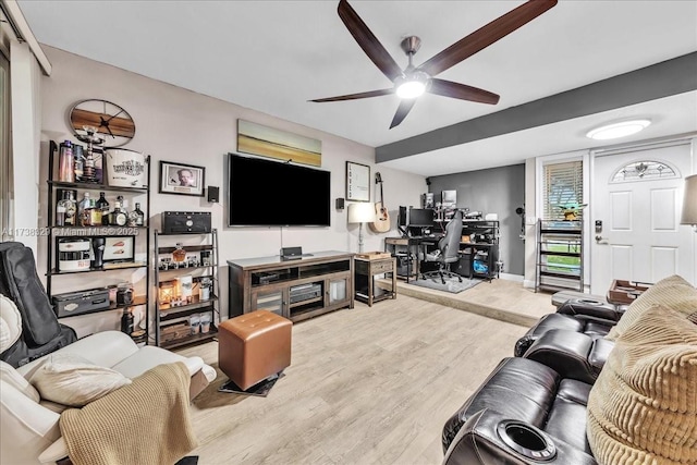 living room featuring ceiling fan and light wood-type flooring