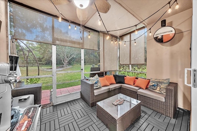 sunroom with plenty of natural light and ceiling fan