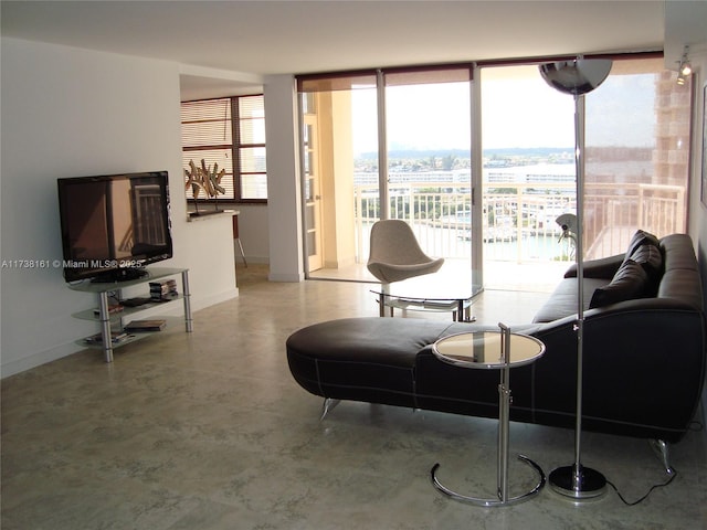 living room with floor to ceiling windows