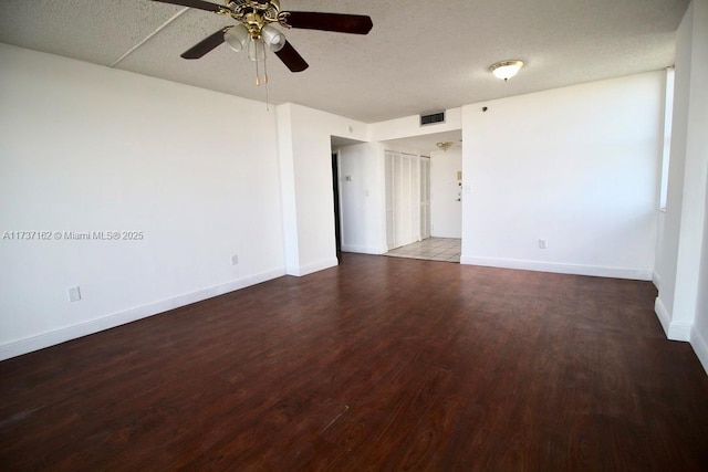 unfurnished room featuring ceiling fan, hardwood / wood-style flooring, and a textured ceiling