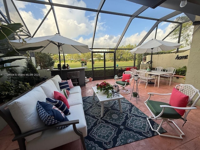 view of patio with an outdoor hangout area and glass enclosure