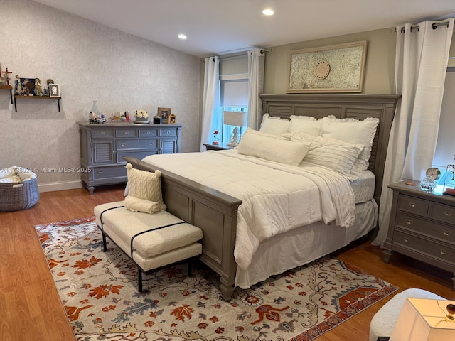 bedroom with wood-type flooring