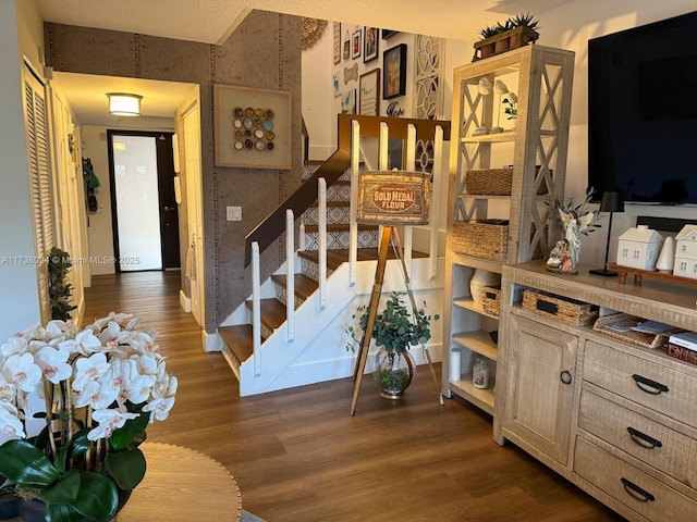 stairs with hardwood / wood-style flooring