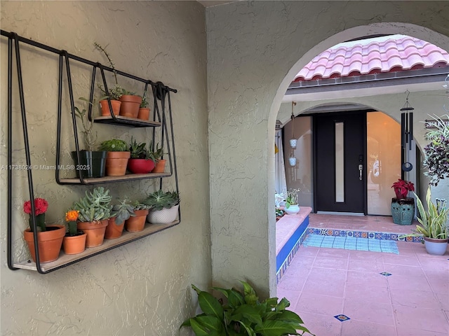 doorway to property with a patio area