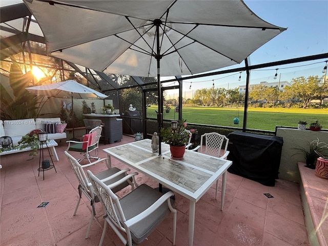 view of patio / terrace with a lanai