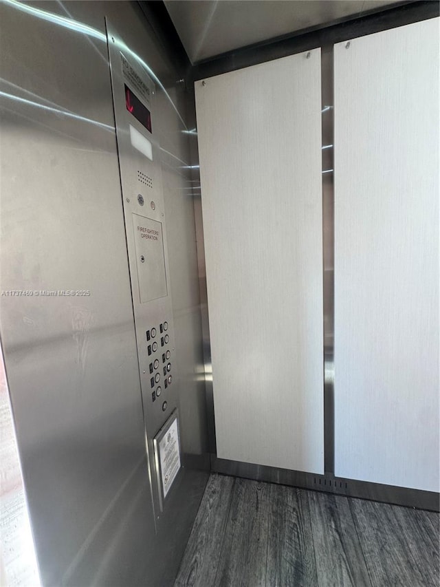 interior space with wood-type flooring and elevator