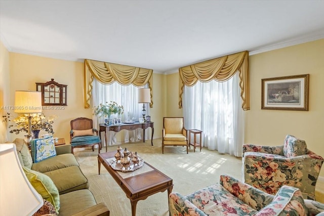 sitting room featuring ornamental molding, plenty of natural light, and carpet flooring