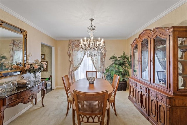 dining space with ornamental molding, light colored carpet, and a chandelier