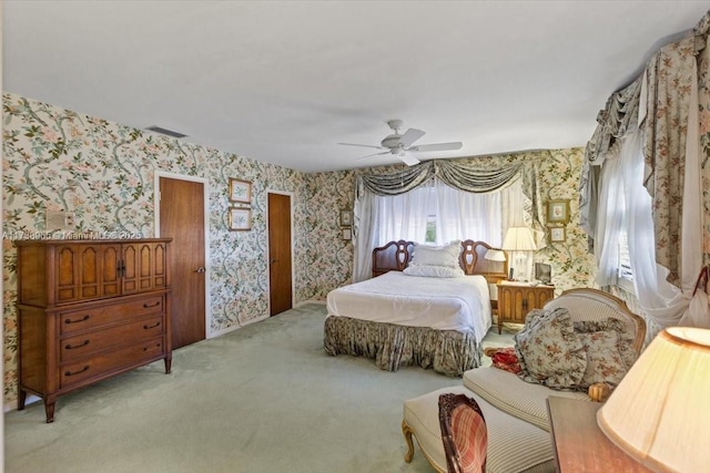 bedroom featuring ceiling fan and light carpet