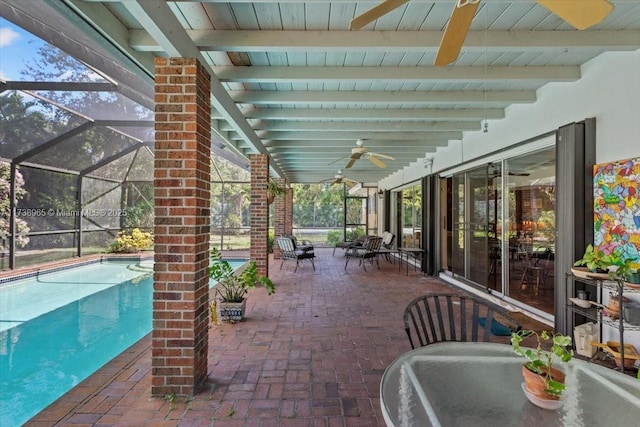 view of patio featuring a lanai