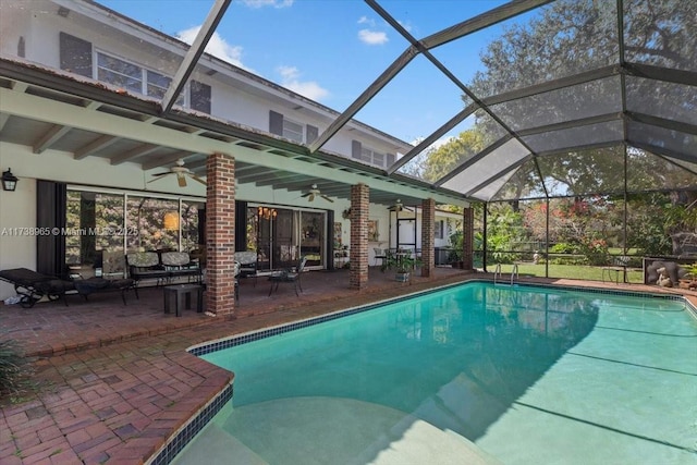 view of swimming pool with a lanai, a patio, and ceiling fan