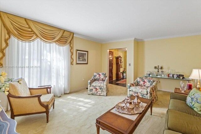 carpeted living room featuring ornamental molding